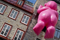 Canada, Quebec Province, Quebec City, Place Royale in Old Quebec City, Vieux Quebec in Basse-Ville or Lower Town. One of the inflatable Mr Pink, or Monsieur Rose S'Envole, sculptures by sculptor Phili...
