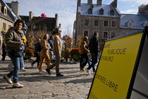 Canada, Quebec Province, Quebec City, Place Royale in Old Quebec City, Vieux Quebec in Basse-Ville or Lower Town. Pedestrians walk past The Quebec Art Gallery. One of the inflatable Mr Pink, or Monsie...