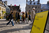 Canada, Quebec Province, Quebec City, Place Royale in Old Quebec City, Vieux Quebec in Basse-Ville or Lower Town. Pedestrians walk past The Quebec Art Gallery. One of the inflatable Mr Pink, or Monsie...
