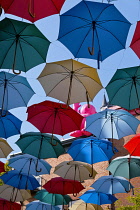 Canada, Quebec Province, Quebec City, Old Quebec City, Vieux Quebec. Chateau Frontenac with the iconic umbrellas on rue du Cul-de-Sac in the Quartier Petit Champlain in Basse-Ville, or Lower Town.