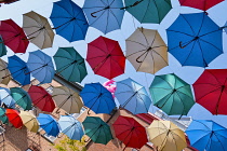 Canada, Quebec Province, Quebec City, Old Quebec City, Vieux Quebec. Chateau Frontenac with the iconic umbrellas on rue du Cul-de-Sac in the Quartier Petit Champlain in Basse-Ville, or Lower Town.