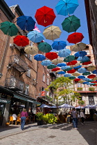 Canada, Quebec Province, Quebec City, Old Quebec City, Vieux Quebec. Chateau Frontenac with the iconic umbrellas on rue du Cul-de-Sac in the Quartier Petit Champlain in Basse-Ville, or Lower Town.