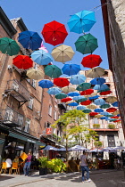 Canada, Quebec Province, Quebec City, Old Quebec City, Vieux Quebec. Chateau Frontenac with the iconic umbrellas on rue du Cul-de-Sac in the Quartier Petit Champlain in Basse-Ville, or Lower Town.