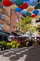 Canada, Quebec Province, Quebec City, Old Quebec City, Vieux Quebec. Chateau Frontenac with the iconic umbrellas on rue du Cul-de-Sac in the Quartier Petit Champlain in Basse-Ville, or Lower Town.
