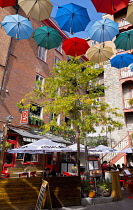 Canada, Quebec Province, Quebec City, Old Quebec City, Vieux Quebec. Chateau Frontenac with the iconic umbrellas on rue du Cul-de-Sac in the Quartier Petit Champlain in Basse-Ville, or Lower Town.