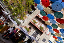Canada, Quebec Province, Quebec City, Old Quebec City, Vieux Quebec. Chateau Frontenac with the iconic umbrellas on rue du Cul-de-Sac in the Quartier Petit Champlain in Basse-Ville, or Lower Town.