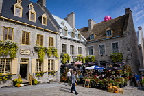 Canada, Quebec Province, Quebec City, Old Quebec City, Vieux Quebec. Place Royale in Basse-Ville, or Lower Town lined with shops and restaurants decorated with pumpkins and autumn foliage for Hallowee...