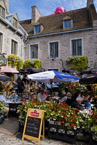Canada, Quebec Province, Quebec City, Old Quebec City, Vieux Quebec. Place Royale in Basse-Ville, or Lower Town lined with shops and restaurants decorated with pumpkins and autumn foliage for Hallowee...