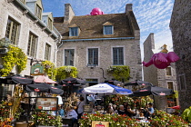 Canada, Quebec Province, Quebec City, Old Quebec City, Vieux Quebec. Place Royale in Basse-Ville, or Lower Town lined with shops and restaurants decorated with pumpkins and autumn foliage for Hallowee...