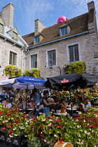 Canada, Quebec Province, Quebec City, Old Quebec City, Vieux Quebec. Place Royale in Basse-Ville, or Lower Town lined with shops and restaurants decorated with pumpkins and autumn foliage for Hallowee...