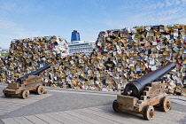 Canada, Quebec Province, Quebec City, Old Quebec City, Vieux Quebec. The artwork CUL-DE-SAC-2024 by Spanish scultor Alicia Martin. A wall of books standing in front of canons on the Royal Battery in B...