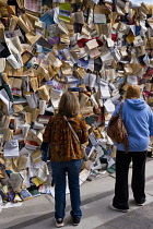 Canada, Quebec Province, Quebec City, Old Quebec City, Vieux Quebec. The artwork CUL-DE-SAC-2024 by Spanish scultor Alicia Martin. A wall of books standing in front of canons on the Royal Battery in B...