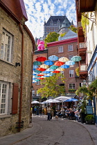 Canada, Quebec Province, Quebec City, Old Quebec City, Vieux Quebec. Chateau Frontenac with the iconic umbrellas on rue du Cul-de-Sac in the Quartier Petit Champlain in Basse-Ville, or Lower Town. One...