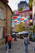 Canada, Quebec Province, Quebec City, Old Quebec City, Vieux Quebec. Chateau Frontenac with the iconic umbrellas on rue du Cul-de-Sac in the Quartier Petit Champlain in Basse-Ville, or Lower Town. One...