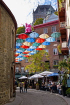 Canada, Quebec Province, Quebec City, Old Quebec City, Vieux Quebec. Chateau Frontenac with the iconic umbrellas on rue du Cul-de-Sac in the Quartier Petit Champlain in Basse-Ville, or Lower Town. One...