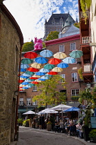 Canada, Quebec Province, Quebec City, Old Quebec City, Vieux Quebec. Chateau Frontenac with the iconic umbrellas on rue du Cul-de-Sac in the Quartier Petit Champlain in Basse-Ville, or Lower Town. One...