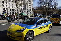 England, London, Cars painted the colours of the Ukranian flag during protest.