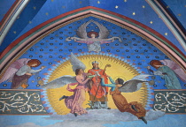 France, Paris, Cathedral de Notre Dame, Colourfu religious artwork in a chapel of the restored cathedral after the fire of 2019.