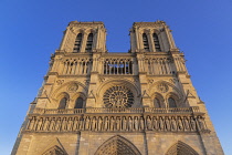 France, Paris, Cathedral de Notre Dame, West facade in golden evening light.