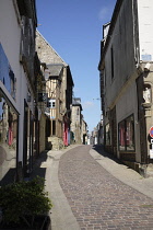 France, Orne, Domfront, Preserved old street with timber framed buildings.