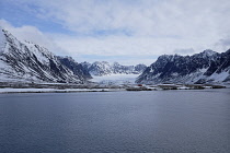 Norway, Svalbard, Mollerfjorden. Tourists visiting Lloyds Hotell. Glacier in the background