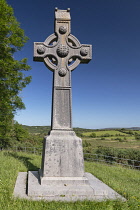 Republic of Ireland, County Donegal, Gartan, Stone cross at the site of Saint Colmcille's birthplace in 521 AD erected by Cornelia Adair in 1911.
