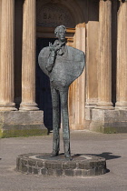 Republic of Ireland, County Sligo, Sligo, Statue of the Anglo-Irish poet W B Yeats in the centre of the town, standing over two metres high this contemporary bronze sculpture by artist Rowan Gillespie...