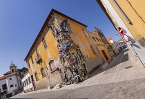 Portugal, Vila Nova de Gaia, The Half Rabbit artwork by Artur Bordalo who calls himself Bordalo II created from discarded items as a critique of human wastefulness.