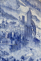Portugal, Porto, Sao Bento railway station built in the early years of the 20th century with detail of one of the large panels of around twenty thousand azulejo tiles designed and painted by Jorge Col...