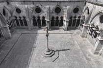 Portugal, Porto, Se do Porto or Porto Cathedral, Gothic cloister viewed from the rooftop terrace with stone cross sculpture in the centre.