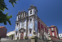 Portugal, Porto, Facade of the 18th century azulejo clad Igreja de Santo Ildefonso or Church of Saint Ildefonso with approximately 11,000 azulejo tiles created by artist Jorge Colaco and placed in Nov...