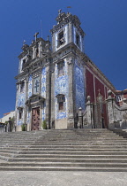 Portugal, Porto, Facade of the 18th century azulejo clad Igreja de Santo Ildefonso or Church of Saint Ildefonso with approximately 11,000 azulejo tiles created by artist Jorge Colaco and placed in Nov...