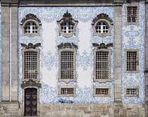 Portugal, Porto, Azulejo clad side wall of the 18th century Igreja do Carmo or The Carmo Church.