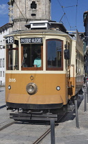 Portugal, Porto, Traditional tram for the city's much touristed Line 18 pictured stationery at the Clerigos Church terminus.