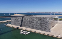 France, Provence, Marseille, Museum of European and Mediterranean Civilisations or MUCEM, a cube of 15,000 square metres or 160,000 sq ft surrounded by a latticework shell of fibre-reinforced concrete...