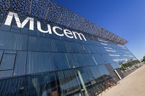 France, Provence, Marseille, Glass facade of the Museum of European and Mediterranean Civilisations or MUCEM, a cube of 15,000 square metres or 160,000 sq ft surrounded by a latticework shell of fibre...