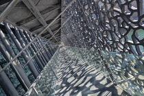 France, Provence, Marseille, Museum of European and Mediterranean Civilisations or MUCEM, a cube of 15,000 square metres or 160,000 sq ft surrounded by a latticework shell of fibre-reinforced concrete...