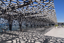 France, Provence, Marseille, Museum of European and Mediterranean Civilisations or MUCEM, a cube of 15,000 square metres or 160,000 sq ft surrounded by a latticework shell of fibre-reinforced concrete...