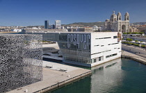 France, Provence, Marseille, Museum of European and Mediterranean Civilisations or MUCEM with the Cosquer Mediterranee and Marseille Cathedral behind.
