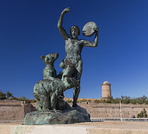 France, Provence, Marseille, Fort Saint Jean, Le Dresseur d'Oursons or The Bear Trainer by Louis Botinelly with the  Tour du Fanal in the background.